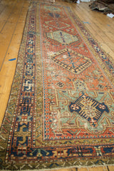 Antique Persian Karaja runner, brick red field, geometric medallions, hook-and-latch motifs.