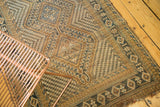 Detailed view of the vintage Afshar runner, showcasing geometric patterns and time-softened tones.