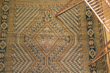 Detailed hand-knotted pattern of the Afshar runner with worn texture, gold, blue, and brown.