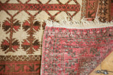 Natural ivory fringe and hand-knotted red-brown backing of a vintage Turkmen rug.