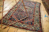 Finely woven Borchalou rug corner, fringe, madder red, navy, and playful beige boteh borders.