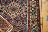 Vintage Borchalou rug, covered field featuring Herati pattern in navy and madder red.