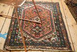Vintage Borchalou rug with unusual dark blush field, blue diamond medallion, Herati motif.