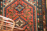 Vintage Borchalou rug featuring abbreviated Herati motif field and barber pole border in blush, blue, ivory.