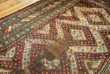Geometric navy blue, madder red, and beige patterns with heavy foundation on vintage Caucasian runner.