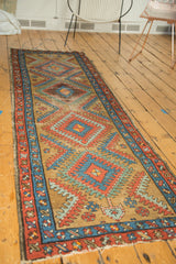 Hand-knotted vintage Bakshaish runner, featuring serrated geometric diamonds in madder red and sky blue.