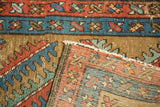 Vintage Bakshaish rug edge showing its tightly hand knotted foundation and colorful geometric pile.