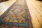 Bakshaish runner side border, geometric patterns in madder root red, sky blue, worn edge.