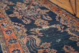 Antique Lilihan runner detail: distressed navy indigo ground, blush and terra cotta florals.