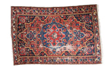 Distressed vintage Baktiari rug with ruby red and sapphire blue geometric medallion, 4'6