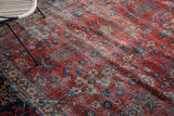 Decorative distressed texture, floral motifs, and visible foundation on a vintage Mahal carpet.