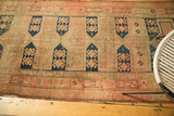 Antique Caucasian runner's sand field, blush tones, navy crab designs, and visible foundation.