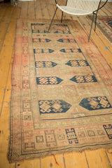 Antique Caucasian runner with navy geometric cartouches featuring stylized crab designs.