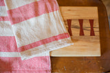 Handwoven Loomination red and cream ticking stripe dish towel.