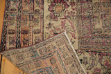 Antique Kermanshah carpet corner folded to show the hand-knotted foundation and low pile.