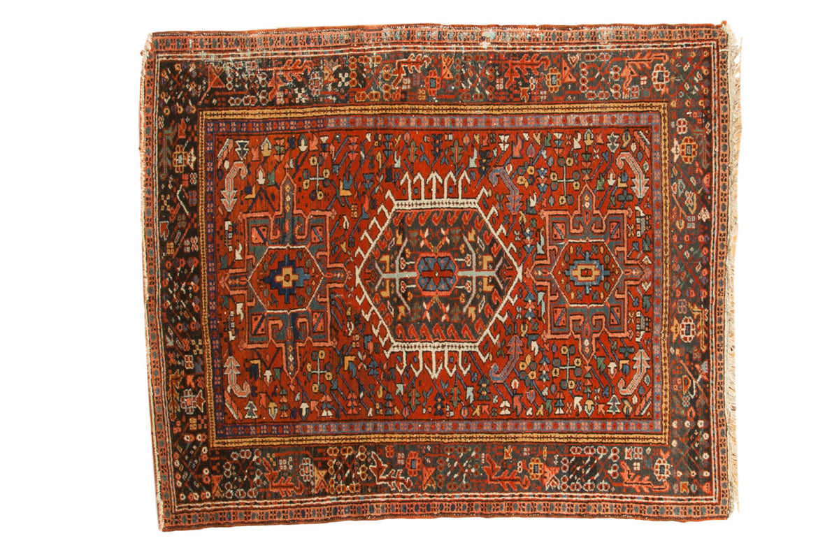 Vintage hand-knotted Karaja square rug with geometric medallion, brick red, blue, and charcoal.