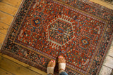 Finely woven geometric Karaja rug pattern in brick red, powder blue, and dark teal.