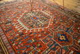 Hand-knotted vintage Karaja rug, intricate geometry in brick red, powder blue, and teal.