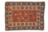 Antique Kazak rug mat, playful animal, serpent field, starburst borders, red, blue, beige.