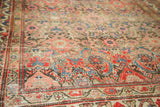 Antique Hamadan rug's Herati pattern, aged bronze, red, navy tones, and visible foundation.