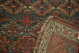 Antique Kurdish Bijar rug hand-knotted pile, woven back, henna plant design, indigo, red, green.