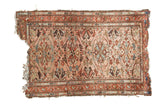 Hand-knotted Vintage Lilihan rug with a dust rose floral field, terra cotta and blue motifs, and worn ends.