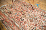 Vintage Persian Lilihan rug's allover floral field in dust rose, terra cotta, light blue.
