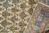 Lattice diamond motif in pale gold, blue, and brown, with original corded selvedge.