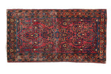 Rich cranberry red vintage Sarouk runner, diminutive medallion, allover floral vines.