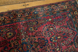 Hand knotted German Sarouk runner corner: cranberry field, delicate blue floral motifs, patterned border.
