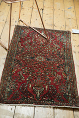 Hand-knotted vintage runner with vase tree of life motif, cherry red field, and beige fringe.