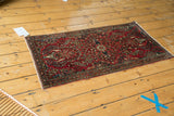Cherry red Persian Sarouk runner featuring vase tree of life and allover floral patterns.
