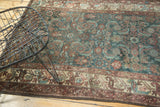 Vintage Malayer rug's repeating Herati design with animals in aubergine, navy, and antique ivory.