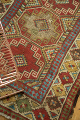 Antique Caucasian runner detail: geometric patterns, abrashes, and historic wear.