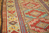 Antique Caucasian runner with Laleh Abassi pawn design border and brick red abrashes.