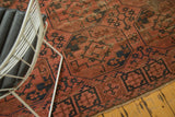Restored triple side cord selvage on the antique Afghan Ensi carpet's geometric gul pattern.