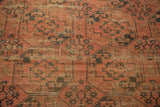 Repeating oversized gul motif on antique Ensi carpet, showcasing wear to knot heads.