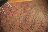 Visible wear to knot heads on the antique Afghan Ensi's repeating gul motif.
