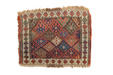 Antique Jaff Kurd mat, geometric diamond lattice in madder red, indigo blue, green, and ivory.