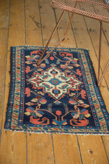 Vintage Borchalou rug end, indigo field with scrolling florals, and time-softened fringe.