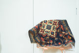 Vintage Borchalou rug pile with quatrefoil medallion, geometric florals, indigo and terra cotta.