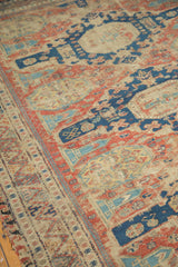 Antique Caucasian Soumac rug section showcasing geometric border, madder red, and storied wear.