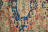 Textural detail of geometric red and blue floral motifs on the ancient Soumac flat-weave.