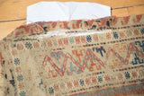 Antique Caucasian Soumac rug with split side border, tatter, and geometric red-blue patterns.