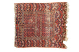 Antique Turkmen square rug, red, navy, ivory geometric design, with worn ends and hole.
