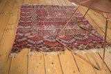Tattered fringe and perimeter wear on a geometric antique Turkmen rug.