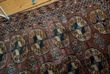 Triple Bokhara gul pattern in dark eggplant, navy, and antique ivory on a vintage Turkmen rug.