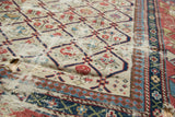 Fragmented antique Dagestan Caucasian rug showing geometric borders, intricate floral motifs, and visible foundation.