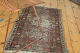 Vintage Karaja rug runner showing geometric design in cherry red, mallard green, and multi-color selvage.