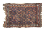 Antique Belouch rug, early 20th century, allover geometric lattice, aubergine, blue, terra cotta, tattered edges.